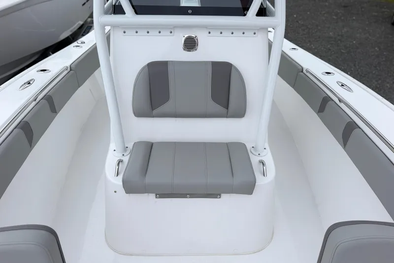 Slide: The Image of 2026 Cape Horn 28XS boat interior with gray seating and white console. - 13