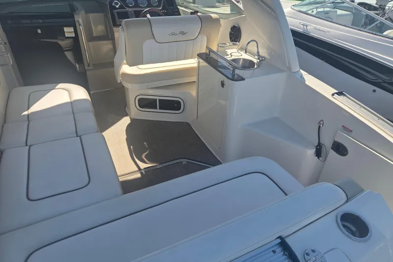 Slide: The Image of Interior of a 2012 Sea Ray Sundancer 260 boat with seating and kitchenette. - 6