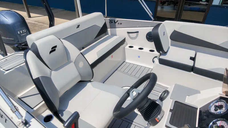 Slide: The Image of The image shows the interior of a Starcraft SV 18 OB boat with modern seating. - 5