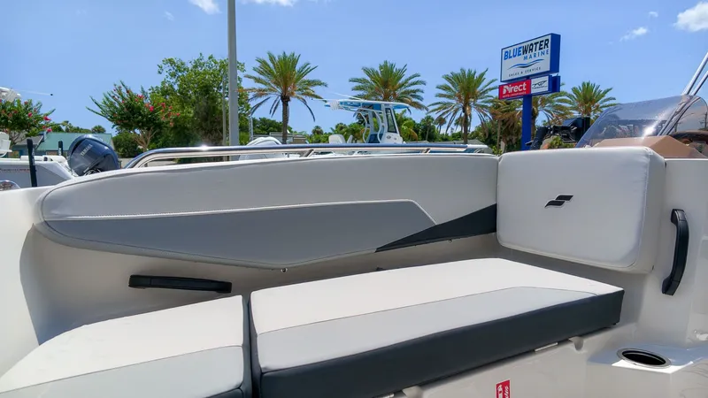 Slide: The Image of The image shows the interior of a Starcraft SV 18 OB boat with white upholstery. - 16