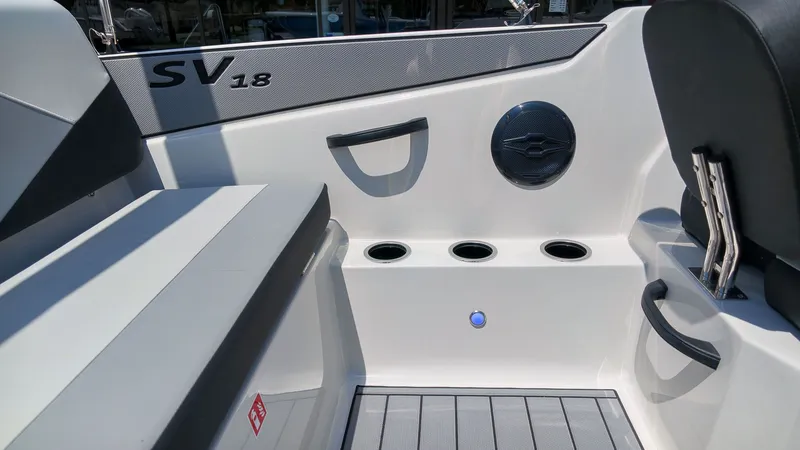 Slide: The Image of Interior view of a Starcraft SV 18 OB boat with seating and cup holders. - 9