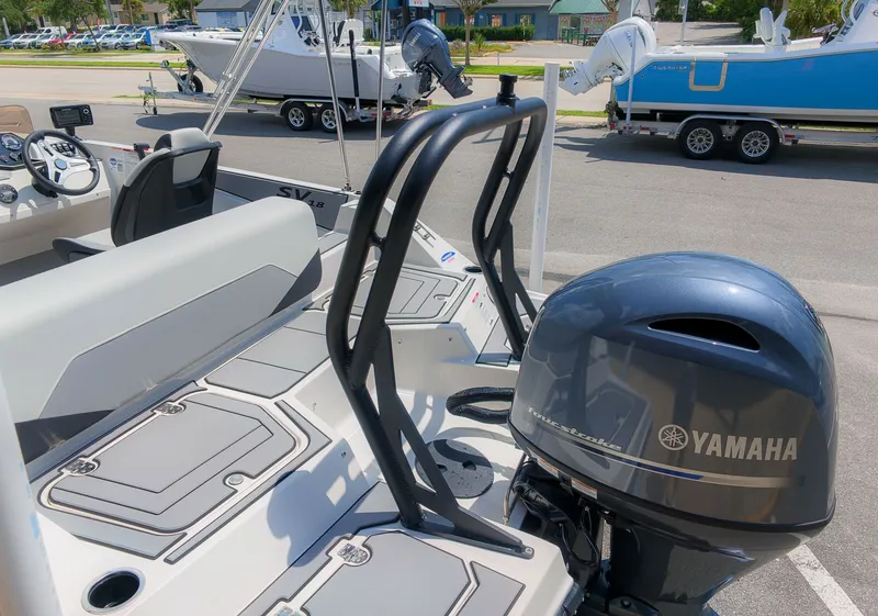 The Image of The image shows a Starcraft SV 18 OB boat with a Yamaha outboard motor. - 1