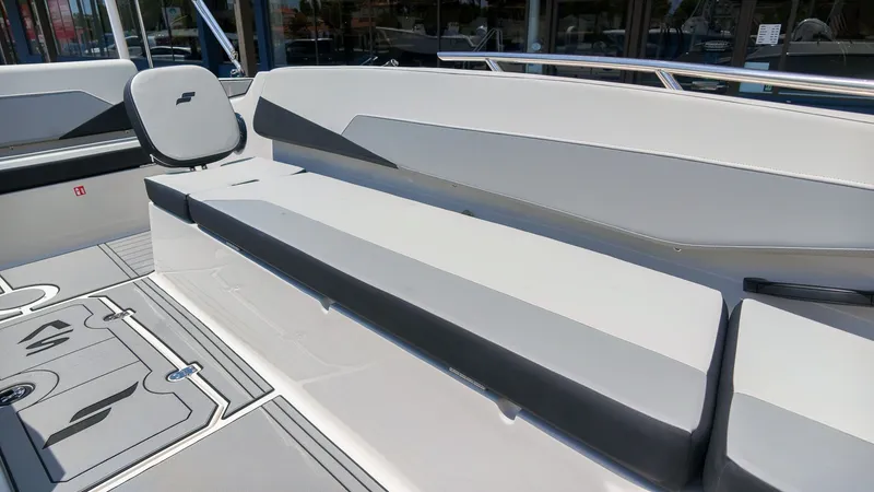 Slide: The Image of The image shows the interior of a 2027 Starcraft SV 18 OB boat with gray upholstery. - 10