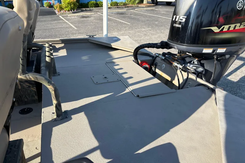 Slide: The Image of 2019 War Eagle 961 Blackhawk boat with Yamaha 115 VMAX engine in parking lot. - 6