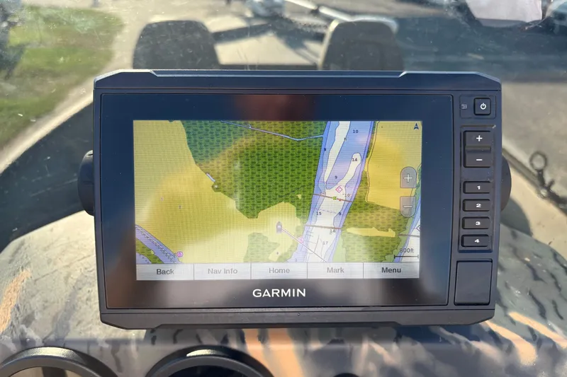 Slide: The Image of Garmin GPS displaying a detailed map on a 2019 War Eagle 961 Blackhawk boat. - 11