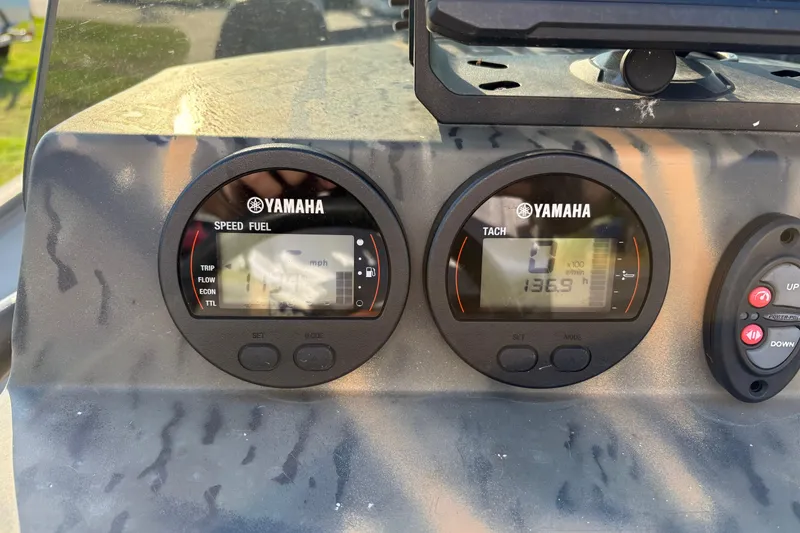 Slide: The Image of Yamaha speed and tachometer gauges on 2019 War Eagle 961 Blackhawk boat dashboard. - 10
