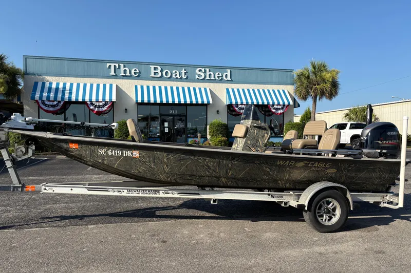 The Image of 2019 War Eagle 961 Blackhawk boat on trailer outside The Boat Shed. - 0