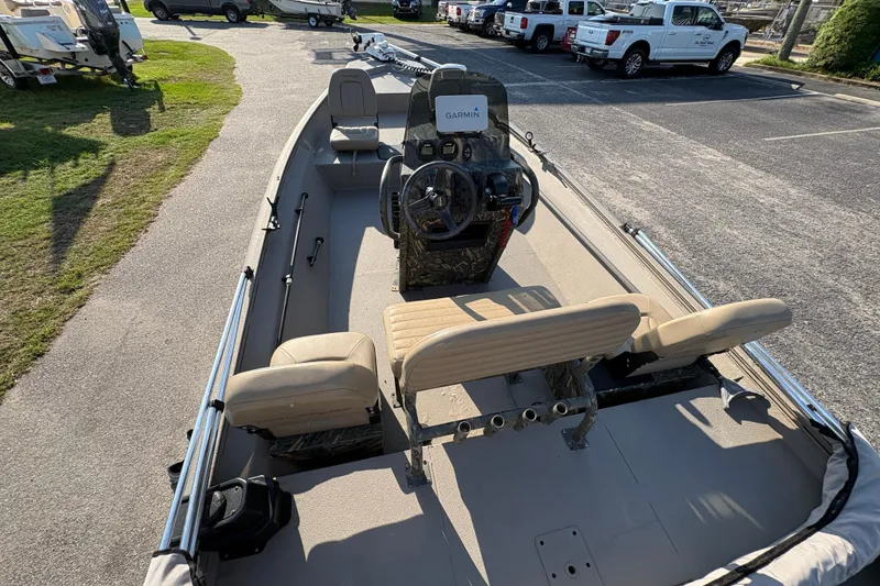 Slide: The Image of 2019 War Eagle 961 Blackhawk boat interior with seating and Garmin navigation system. - 7