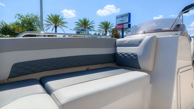 Slide: The Image of The image shows a boat's seating area with gray and white upholstery. - 16