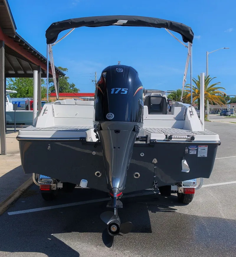 Slide: The Image of The image shows a 2027 Starcraft SVX 211 OB boat with a 175 HP outboard motor. - 3