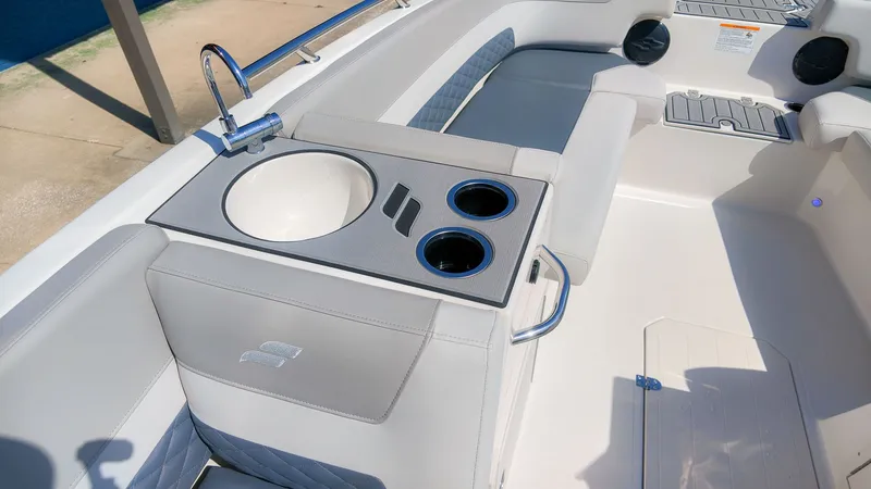 Slide: The Image of The image shows the cockpit of a Starcraft SVX 211 OB with a sink and cup holders. - 10