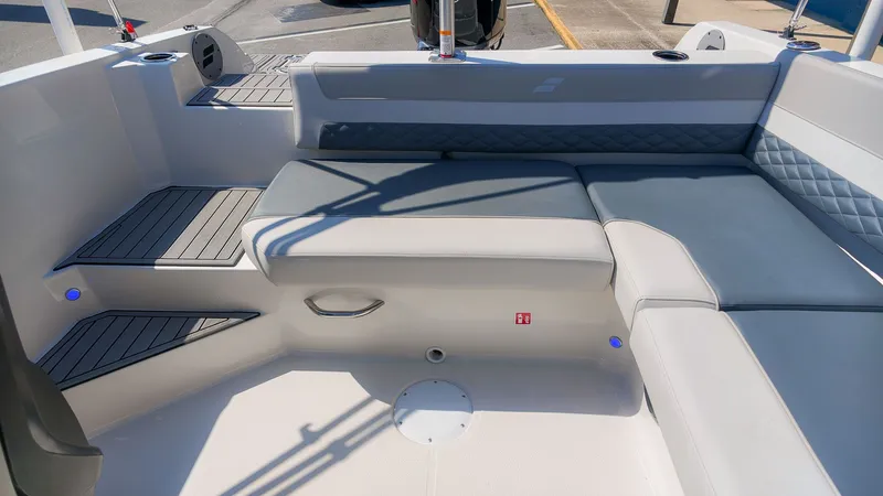 Slide: The Image of The image shows the interior of a Starcraft SVX 211 OB boat with gray and white upholstery. - 6