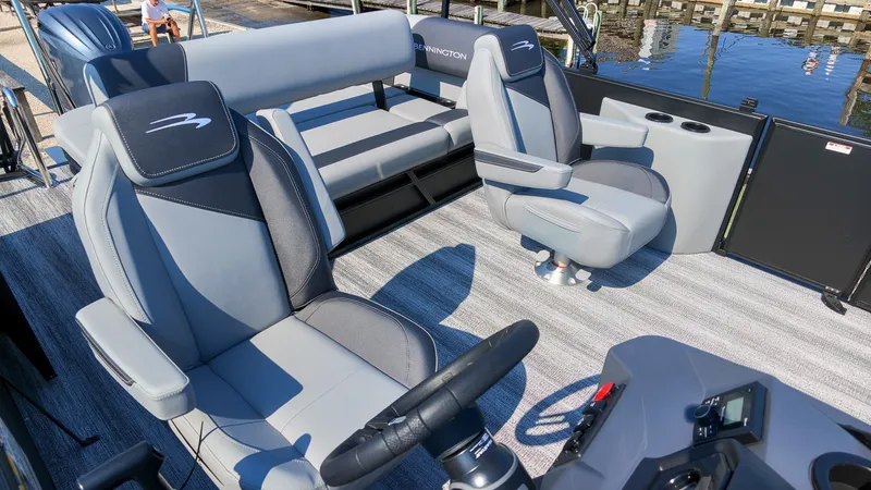 Slide: The Image of The image shows the interior of a 2027 Bennington 21 S Swingback with luxurious seating and a modern helm. - 5