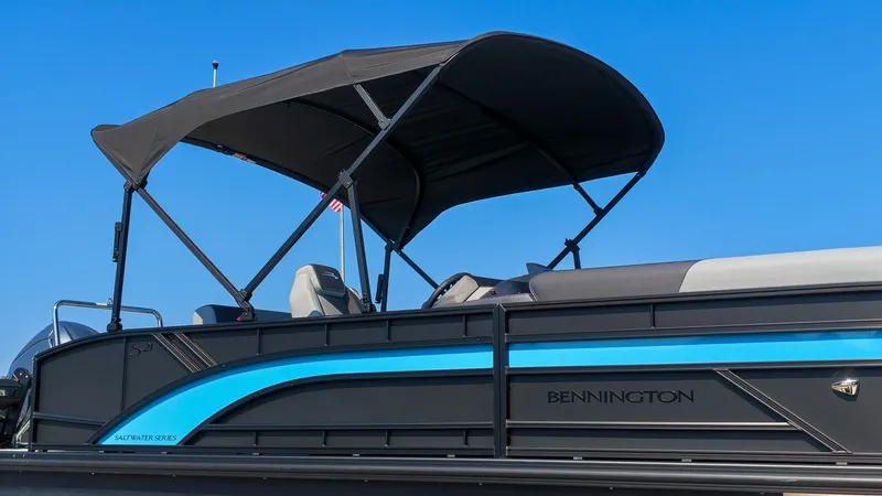 Slide: The Image of Bennington 21 S Swingback 2027 with a black sunshade and blue accent line. - 23