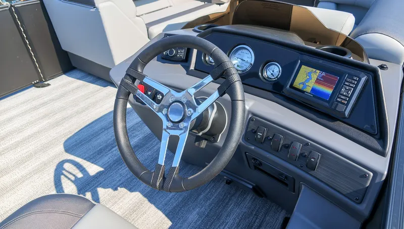 Slide: The Image of The image shows the cockpit of a 2027 Bennington 21 S Swingback with a modern steering wheel and instruments. - 19