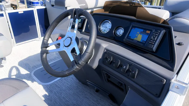 Slide: The Image of The image shows the cockpit of a 2027 Bennington 22 S Swingback with a modern steering wheel and instruments. - 20