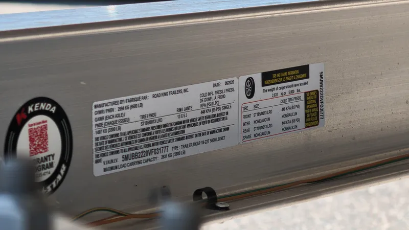Slide: The Image of A label on a boat trailer displays technical details and safety information. - 22