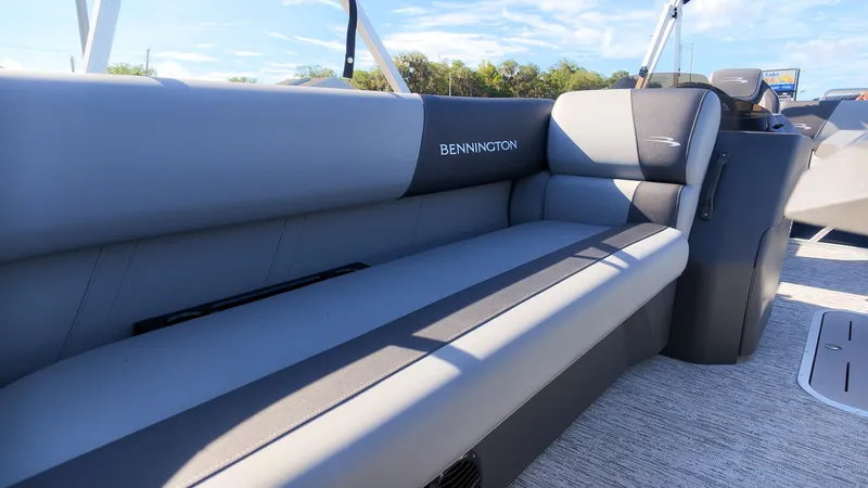 Slide: The Image of The gray seating on a Bennington boat offers comfortable cushioning and stylish design. - 17