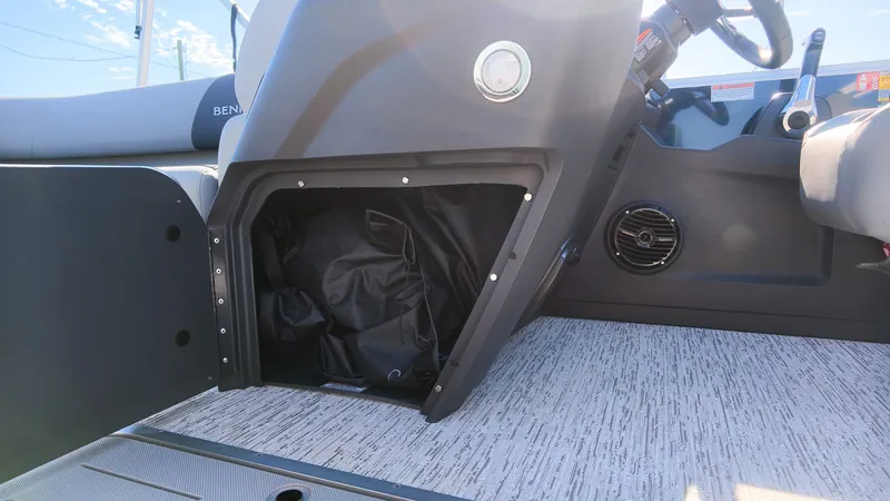 Slide: The Image of The image shows the cockpit of a Bennington 22 S Swingback with an open storage compartment. - 17