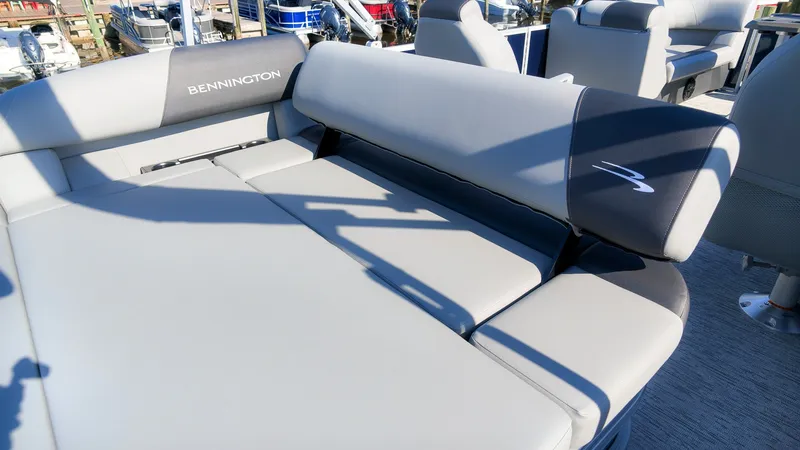 Slide: The Image of Bennington 22 S Swingback 2027: Luxurious gray upholstery on a spacious deck, perfect for relaxing. - 6