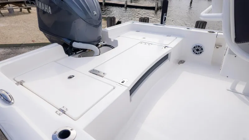 Slide: The Image of The image shows the stern of a Tidewater 2210 Carolina Bay boat with a Yamaha engine. - 5