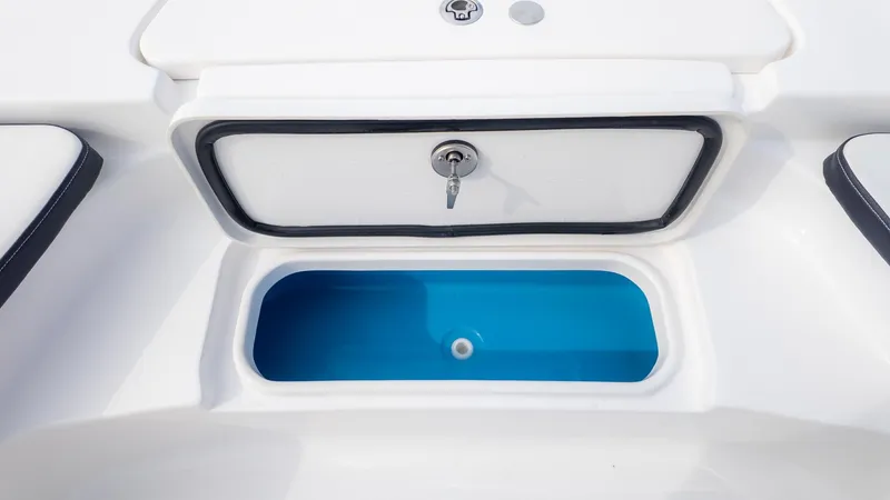 Slide: The Image of A white boat with a blue storage compartment and a lockable lid. - 16