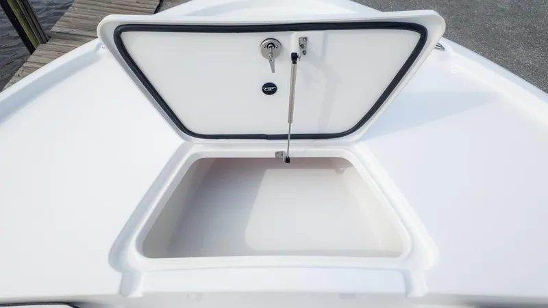Slide: The Image of An open storage compartment on a boat with a lid and hinge. - 17