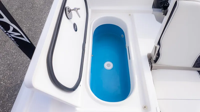 Slide: The Image of An open storage compartment with a blue interior on a boat. - 6