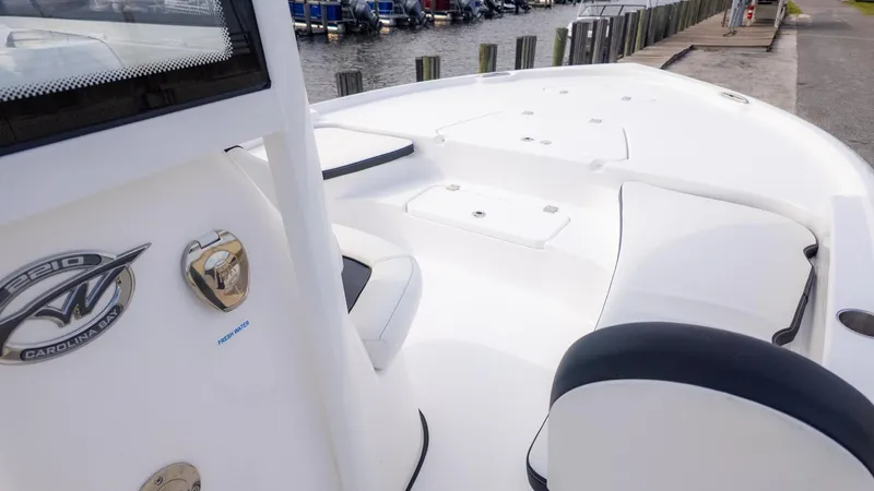 Slide: The Image of The image shows the deck of a Tidewater 2210 Carolina Bay boat. - 13