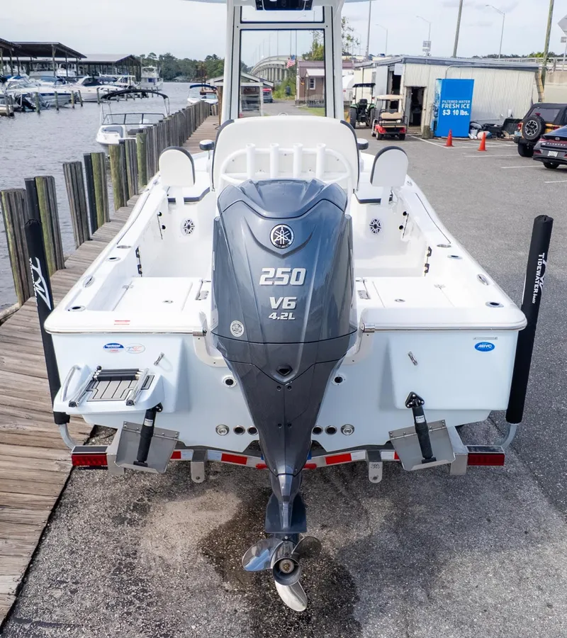 Slide: The Image of The image shows a Tidewater 2210 Carolina Bay boat with a Yamaha 250 V6 outboard motor. - 2