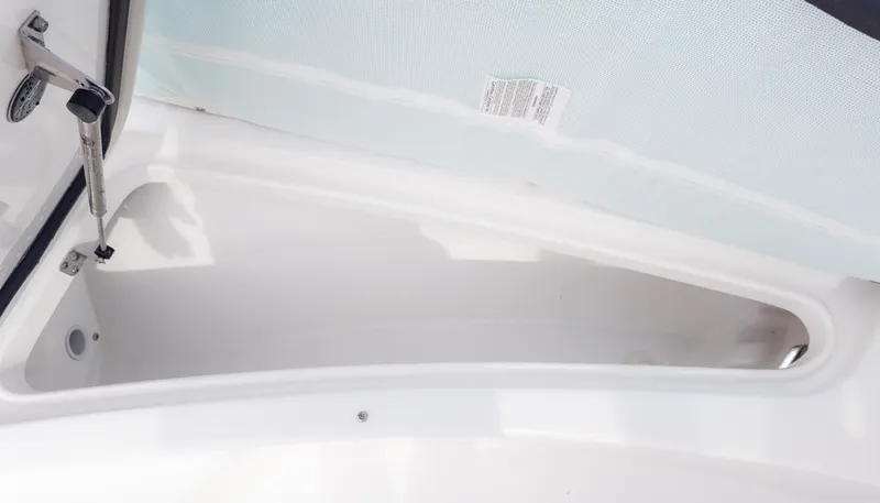 Slide: The Image of Interior view of a storage compartment on a Tidewater 2210 Carolina Bay boat. - 13