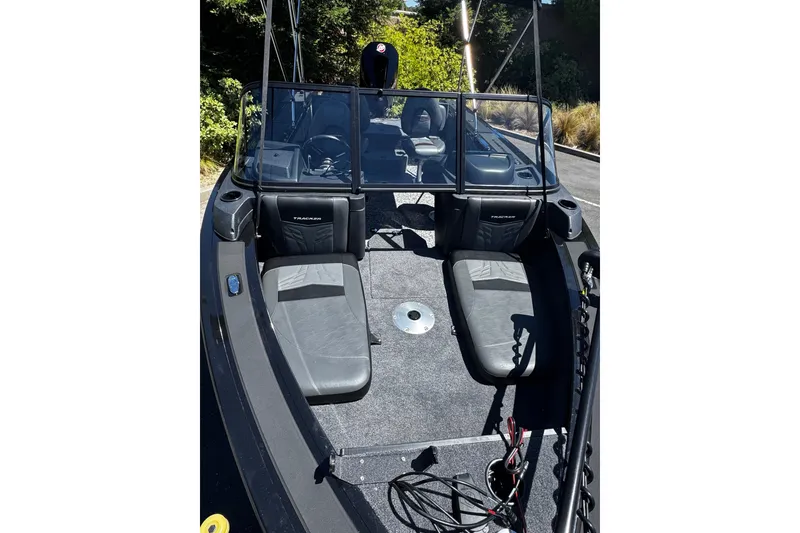 Slide: The Image of 2026 Tracker Targa V-19 Combo boat interior with seating and steering wheel. - 4