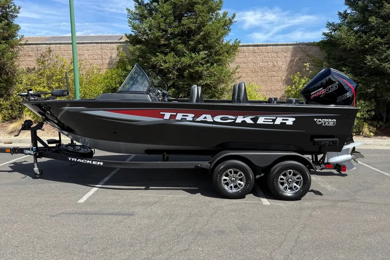 The Image of 2026 Tracker Targa V-19 Combo boat on trailer, parked outdoors. - 0