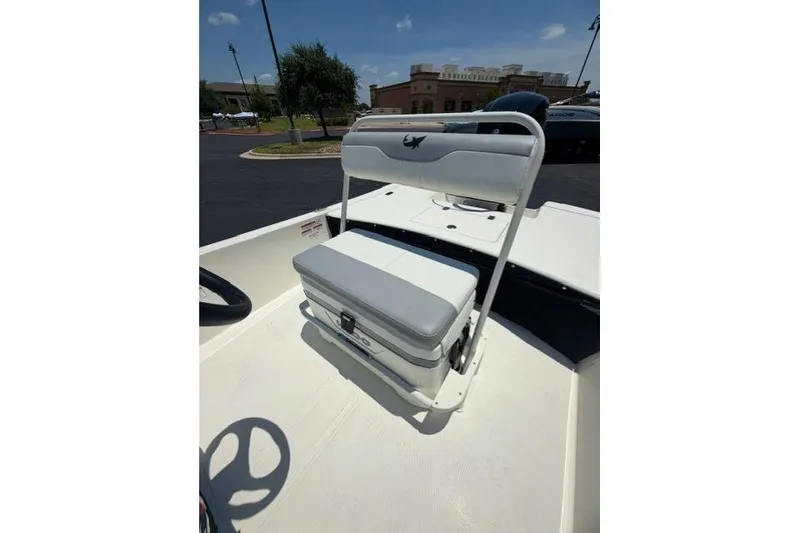 Slide: The Image of 2026 Mako Pro Skiff 17 CC boat interior with seating and storage. - 10