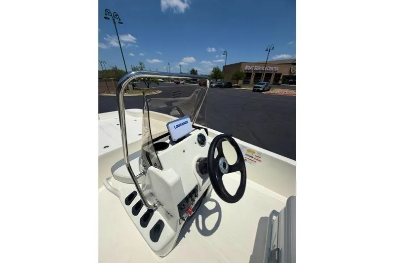 Slide: The Image of 2026 Mako Pro Skiff 17 CC boat console with steering wheel and navigation system. - 8