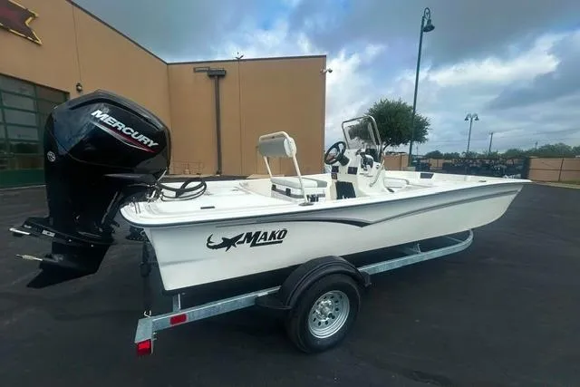 The Image of 2026 Mako Pro Skiff 17 CC boat on trailer with Mercury outboard motor. - 0