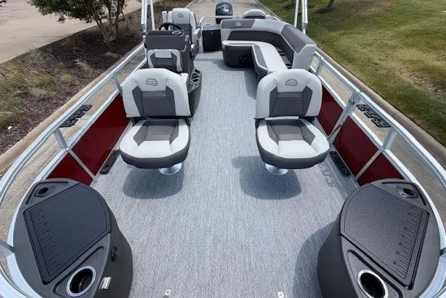 Slide: The Image of 2026 Sun Tracker Bass Buggy 18 DLX pontoon boat interior with seating and helm. - 10