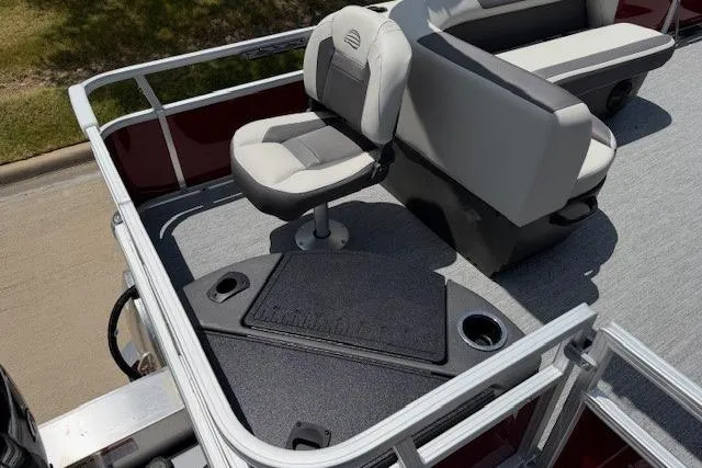Slide: The Image of 2026 Sun Tracker Bass Buggy 18 DLX boat interior with swivel seat and cup holders. - 12