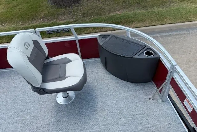 Slide: The Image of 2026 Sun Tracker Bass Buggy 18 DLX boat interior with swivel seat and storage compartment. - 15