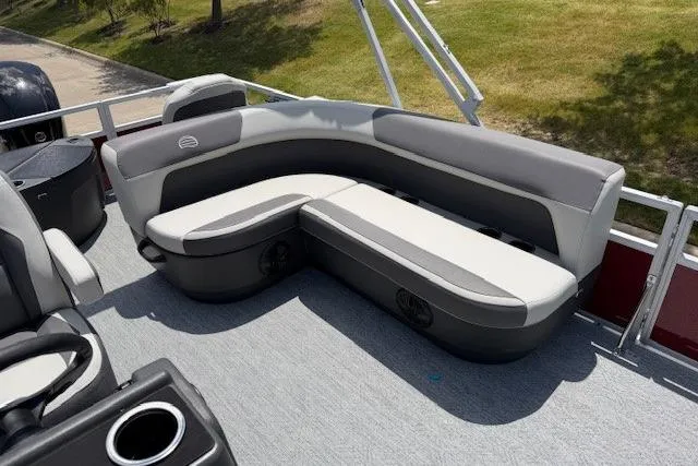 Slide: The Image of 2026 Sun Tracker Bass Buggy 18 DLX pontoon boat with comfortable seating. - 13