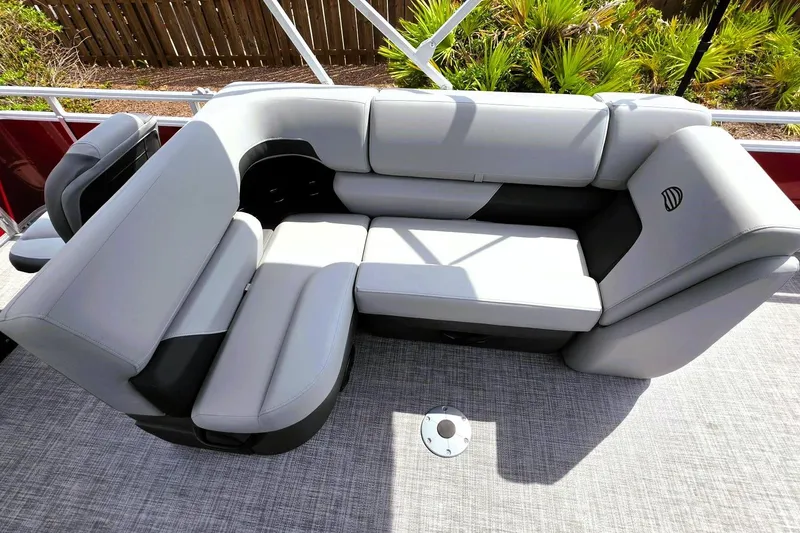 Slide: The Image of Luxurious seating on 2026 Sun Tracker SportFish 20 DLX pontoon boat, featuring plush gray upholstery. - 18