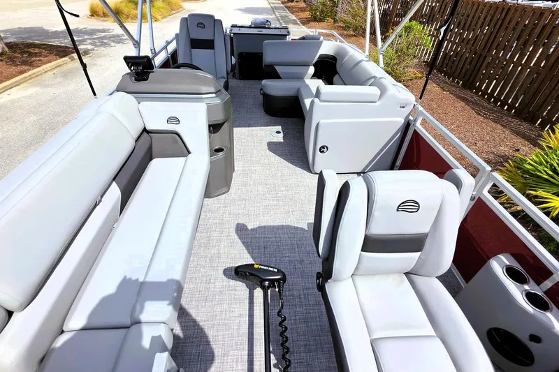 Slide: The Image of 2026 Sun Tracker SportFish 20 DLX pontoon boat interior with plush seating and modern design. - 15