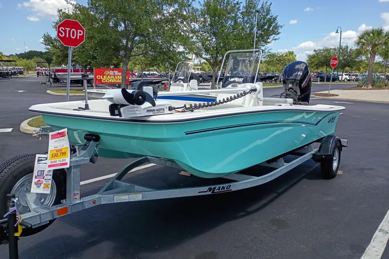 The Image of 2026 Mako Pro Skiff 17 CC boat on trailer, displayed in parking lot with sale price. - 0