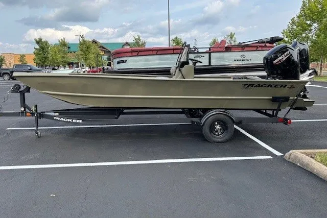 The Image of 2026 Tracker Grizzly 2072 CC boat on trailer in parking lot, side view. - 0