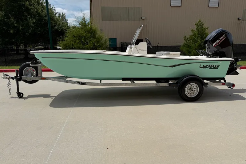 The Image of 2026 Mako Pro Skiff 17 CC boat on trailer, parked outdoors. - 0
