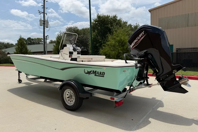 Slide: The Image of 2026 Mako Pro Skiff 17 CC boat on trailer with Mercury outboard motor. - 5