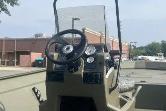 Slide: The Image of 2026 Tracker Grizzly 2072 CC boat console with steering wheel and gauges. - 4