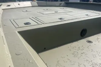 Slide: The Image of 2026 Tracker Grizzly 2072 CC boat deck with storage compartments, showcasing durable design. - 6