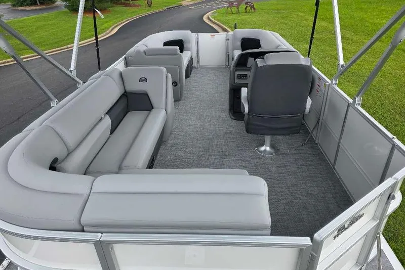 Slide: The Image of 2026 Sun Tracker Party Barge 20 DLX interior with gray seating and spacious layout. - 7