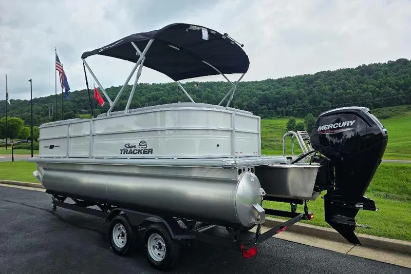 Slide: The Image of 2026 Sun Tracker Party Barge 20 DLX pontoon boat with Mercury engine on trailer. - 3